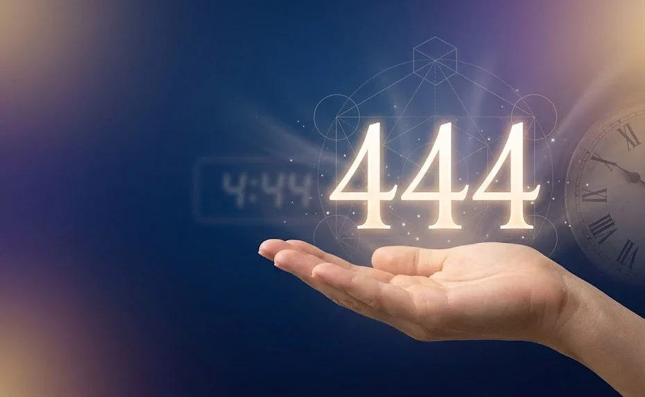 Glowing golden 444 angel number floating above an open palm representing protection and spiritual 444 angel number meaning.
